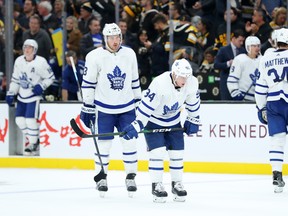 Maple Leafs’ Frederik Gauthier (left), Tyson Barrie and Auston Matthews look crestfallen following a loss in Boston last month. Toronto finished October with a record of 6-5-3 and hopes to start November with a win in Philadelphia on Saturday night. (GETTY IMAGES)
