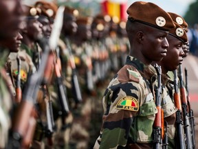 In this file photo taken on Sept. 22, 2018, Malian soldiers take part in celebrations marking Mali's 58th anniversary of independence in Bamako.