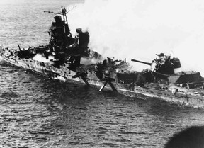 A Japanese destroyer ablaze at the Battle of Midway in June 1942. US NAVY