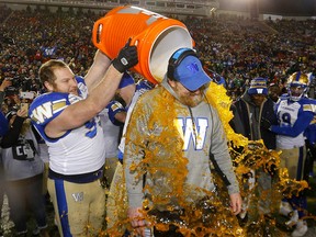 Winnipeg Blue Bombers coach Mike O'Shea gets the Gatorade shower after beating the Hamilton Tiger-Cats in the 107th Grey Cup at McMahon Stadium in Calgary on Sunday, November 24, 2019. (Darren Makowichuk/Postmedia)