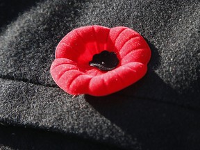 A person wears a poppy in downtown Toronto on Friday, Nov. 8, 2019.