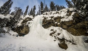 A frozen Smith Falls is a quick walk from the trail during a snowmobile tour with Toby Creek Adventures in Panorama, British Columbia. Ernest Doroszuk/Toronto Sun