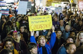 Protestors outside the Palmerston Library following a talk by controversial speaker Meghan Murphy at the basement theatre in Toronto, Ont. on Tuesday, Oct. 29, 2019. (Toronto Sun/Postmedia)