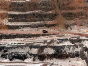 In this file photo taken on March 21, 2012, a mining truck travels through the ArcelorMittal mining complex in Fermont, Que.