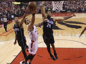 Montreal's Khem Birch, of the Orlando Magic, tries to block a Fred VanVleet shot during the playoffs last season. Jack Boland/Toronto Sun/Postmedia Network