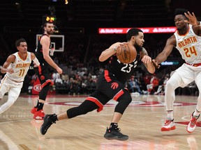 Raptors guard Fred VanVleet (left) drives against Atlanta Hawks forward Bruno Fernando last night at State Farm Arena. The Raptors won 119-116. (USA TODAY)