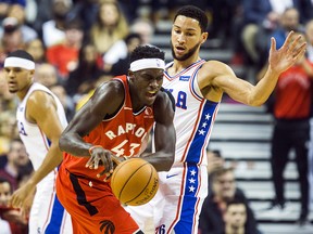 Toronto Raptors’ Pascal Siakam loses the handle on the ball while being defended by Philadelphia 76ers’ Ben Simmons at the Scotiabank Arena in Toronto on Monday, November 25, 2019. (Ernest Doroszuk/Toronto Sun)