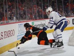 Maple Leafs defenceman Morgan Rielly (right) takes a cross-checking penalty against Travis Konecny of the Philadelphia Flyers on Saturday night at the Wells Fargo Center. Toronto is taking almost four penalties a night.(Bruce Bennett/Getty Images)