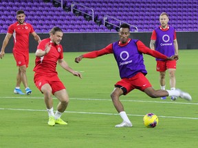 Canada midfielder Mark-Anthony Kaye, takes a shot with Samuel Piette defending while Scott Arfield, right, and Lucas Cavallini look on at Exploria Stadium in Orlando, Fla., on Thursday, Nov. 14, 2019.