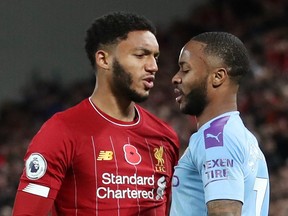 Liverpool's Joe Gomez (left) and Manchester City's Raheem Sterling clash during an England Premier League game on Nov. 10, 2019 in Liverpool, England.  (CARL RECINE/Reuters)