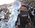 Hamilton Tiger-Cats head coach Orlondo Steinauer gets doused with ice water after defeating the Edmonton Eskimos during the East final at Tim Hortons Field. (John E. Sokolowski-USA TODAY Sports)