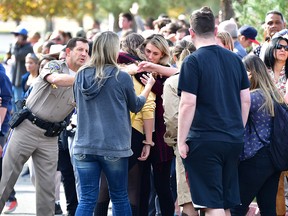 Grieving students from Saugus High School reunite with their parents at Central Park in Santa Clarita, Calif., on Nov. 14, 2019.
