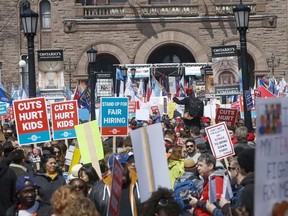 At a rally at Queen's Park in the spring, thousands of teachers, students and unions came out to protest various education cuts, including increases to class sizes. (Jack Boland/Toronto Sun/Postmedia Network)
