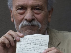 Frank Clemente holds a letter he found in an envelope in downtown Toronto. The letter was written by a Canadian soldier during the Second World War. (Stan Behal/Toronto Sun)