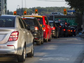 Late afternoon traffic along Spadina Ave. of cars waiting to exit onto the westbound Gardiner Expressway in Toronto, Ont. on Sept. 4, 2018.