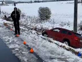 A tow truck driver pulling this vehicle out of a ditch on Highway 12, north of Line 12, was fatally struck on Thursday, Nov. 7, 2019. (Twitter)