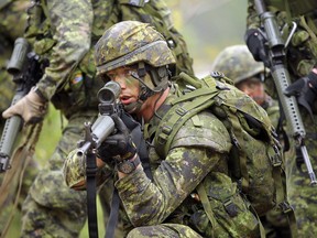 Members of the 3rd Battalion of the Royal Canadian Regiment train at CFB Petawawa on May 15, 2013. (Julie Oliver/OttawaCitizen file photo)