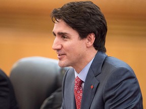 This file photo taken on December 4, 2017, shows Prime Minister Justin Trudeau speaking to China's Premier Li Keqiang during a meeting at the Great Hall of the People in Beijing. (FRED DUFOUR/AFP/Getty Images)