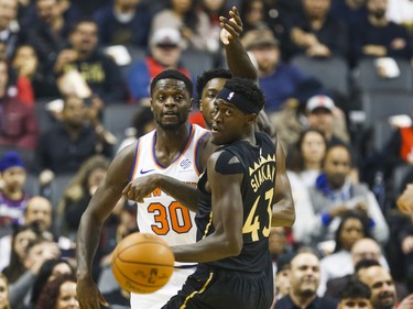 Toronto Raptors Pascal Siakam during 1st half action against New York Knicks 	Julius Randle at the Scotiabank Arena in Toronto, Ont. on Wednesday November 27, 2019. Ernest Doroszuk/Toronto Sun/Postmedia