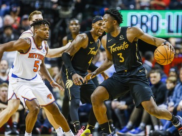 Toronto Raptors OG Anunoby during 2nd half action against New York Knicks  Dennis Smith Jr.at the Scotiabank Arena in Toronto, Ont. on Wednesday November 27, 2019. Ernest Doroszuk/Toronto Sun/Postmedia