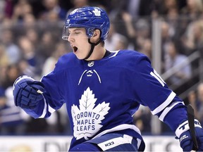 In this Jan. 31, 2018, file photo, Toronto Maple Leafs center Mitch Marner celebrates his goal against the New York Islanders during the second period of an NHL hockey game in Toronto.
