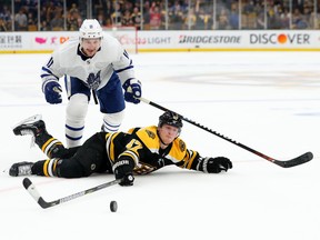 Maple Leafs’ Zach Hyman chases a puck as Bruins’ Torey Krug swipes at it during a first-round playoff game last spring. Hyman, who had knee surgery three months ago, is inching closer to making his return to the lineup. (GETTY IMAGES)