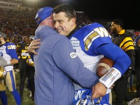 Blue Bombers quarterback 
Zach Collaros embraces one of his coaches on the sideline after beating the Hamilton Tiger-Cats to win the Grey Cup in Calgary.  
DARREN MAKOWICHUK/POSTMEDIA