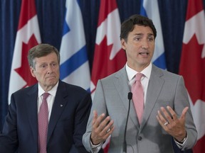 Toronto Mayor John Tory, left, and Prime Minister Justin Trudeau discuss measures to deal with gun violence in the city on August 13, 2019. Stan Behal/Toronto Sun