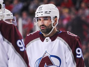 Nazem Kadri #91 of the Colorado Avalanche during a break in play against the Calgary Flames during an NHL game at Scotiabank Saddledome on November 11, 2019 in Calgary. (Photo by Derek Leung/Getty Images)