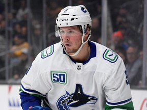 J.T. Miller #9 of the Vancouver Canucks watches play during a 5-3 Canucks win over the Los Angeles Kings at Staples Center on October 30, 2019 in Los Angeles, California. (Photo by Harry How/Getty Images)