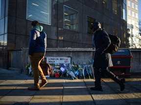 Floral tributes are left for Jack Merritt and Saskia Jones, who were killed in a terror attack, on Dec. 2, 2019 in London. (Peter Summers/Getty Images)