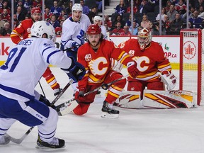 Maple Leafs’ John Tavares takes a shot on Flames goalie David Rittich on Thursday in Calgary. Tavares’ line was on the ice for two of Calgary’s three goals during a rally in the third period.  Derek Leung/Getty Images
