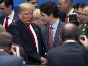 U.S. President Donald Trump (L) and Canadian Prime Minister Justin Trudeau (R) attend the NATO summit at the Grove Hotel on December 4, 2019 in Watford, England.  (Photo by Dan Kitwood/Getty Images)