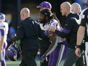 Running back Dalvin Cook of the Minnesota Vikings is helped off the field after injuring his shoulder in the third quarter against the Los Angeles Chargers at Dignity Health Sports Park on December 15, 2019 in Carson, Calif. (Photo by Jeff Gross/Getty Images)