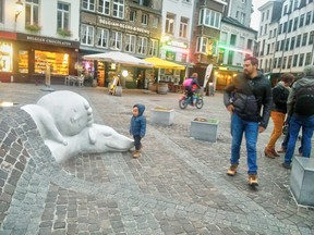 The boy and his dog’ sculpture literally rises out of the ground, captivating passers by of all ages.