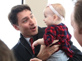 Prime Minister Justin Trudeau holds Maia McGarry during a visit to Sudbury on Feb. 13, 2019. (Postmedia Network photo)