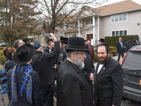 MONSEY, NY -  Members of Rabbi Chaim Rottenberg's community gather in front of the house of Rabbi Chaim Rottenberg on December 29, 2019 in Monsey, New York. Five people were injured in a knife attack during a Hanukkah party and a suspect was later arrested in Harlem. (Getty Images)