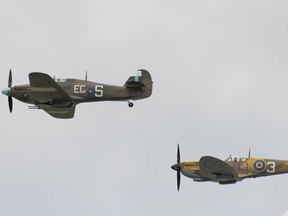 A Battle of Britain memorial flight (Hurricane left and Spitfire right) at RAF Fairford on July 21, 2019 in Fairford, England. (Getty Images)