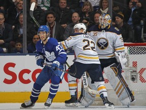 Leafs forward Pierre Engvall battle for position in front of the Sabres net on Tuesday night. (GETTY IMAGES)