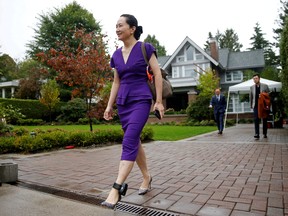 Huawei Technologies Chief Financial Officer Meng Wanzhou leaves her home to appear for a hearing at the Supreme Court of British Columbia in Vancouver, Sept. 23, 2019. (REUTERS/Lindsey Wasson/File Photo)