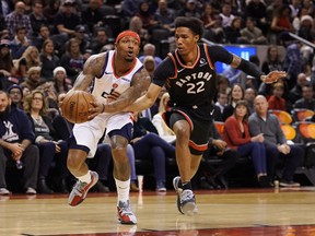 Toronto Raptors forward Patrick McCaw defends against Washington Wizards guard Bradley Beal during Friday's game. (USA TODAY SPORTS)