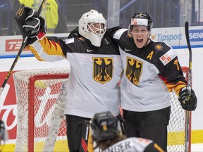Germany's Hendrik Hane, left, and Leon Huttl celebrate after defeating the Czech Republic at the World Junior Hockey Championships, Saturday, Dec. 28, 2019 in Ostrava. Czech Republic. (THE CANADIAN PRESS/Ryan Remiorz)