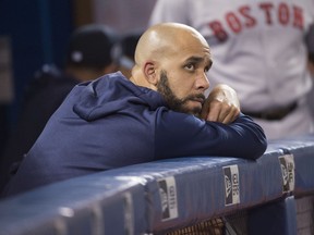 Boston Red Sox starting pitcher David Price (10) looks out from the dugout during the seventh inning against the Toronto Blue Jays at Rogers Centre. Mandatory Credit: Nick Turchiaro-USA TODAY