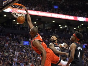 Toronto Raptors centre Serge Ibaka dunks against Houston Rockets guard Ben McLemore (16) and forward Danuel House Jr (4) at Scotiabank Arena. John E. Sokolowski-USA TODAY Sports