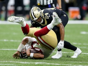San Francisco 49ers quarterback Jimmy Garoppolo (10) is sacked by New Orleans Saints strong safety Vonn Bell.  The 49ers won, 48-46.  Chuck Cook-USA TODAY Sports :