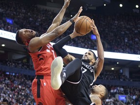 Brooklyn Nets guard Garrett Temple (17) drives to the basket as Toronto Raptors guard Kyle Lowry (7) tries to defend during the fourth quarter at Scotiabank Arena. Nick Turchiaro-USA TODAY Sports