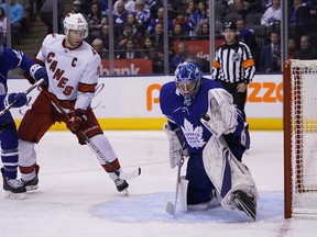 Maple Leafs goaltender Frederik Andersen makes a glove save as Hurricanes’ Jordan Staal yesterday.  John E. Sokolowski/USA TODAy