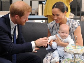 The Duke and Duchess of Sussex, Prince Harry and wife Meghan, hold son Archie as they meet with Archbishop Desmond Tutu (unseen) at the Tutu Legacy Foundation  in Cape Town on September 25, 2019.  HENK KRUGER/AFP/Getty Images