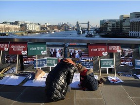 A member of the public writes condolences on London Bridge in memory of the victims of last weeks attack in central London on December 12, 2019.