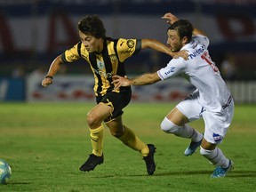 Matias Vina of Nacional and Facundo Pellistri vie for the ball during the Uruguayan Clausura tournament. The 18-year-old winger has enjoyed a breakout season with the Penarol. Getty Images